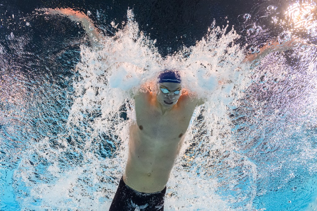 An underwater view shows France's Leon Marchand competing in the final of the men's 200m butterfly swimming event during the Paris 2024 Olympic Games at the Paris La Defense Arena in Nanterre, west of Paris, on July 31, 2024.