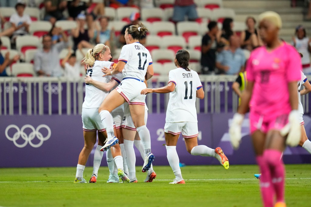 Zambia's goalkeeper Ngambo Musole (r.) looks on as U.S. players celebrate Trinity Rodman's goal during an Olympics matchup in Nice, France on July 25, 2024.