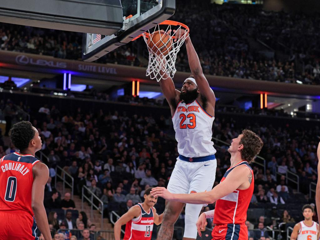 Mitchell Robinson #23 of the New York Knicks slams the ball during the third quarter. 