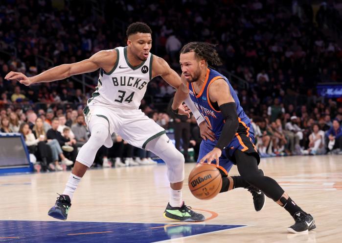 Milwaukee Bucks forward Giannis Antetokounmpo (34) defends against New York Knicks guard Jalen Brunson (11) during the fourth quarter when the Milwaukee Bucks defeated the New York Knicks 130-111 Saturday December 23, 2023 at Madison Square Garden in Manhattan, NY