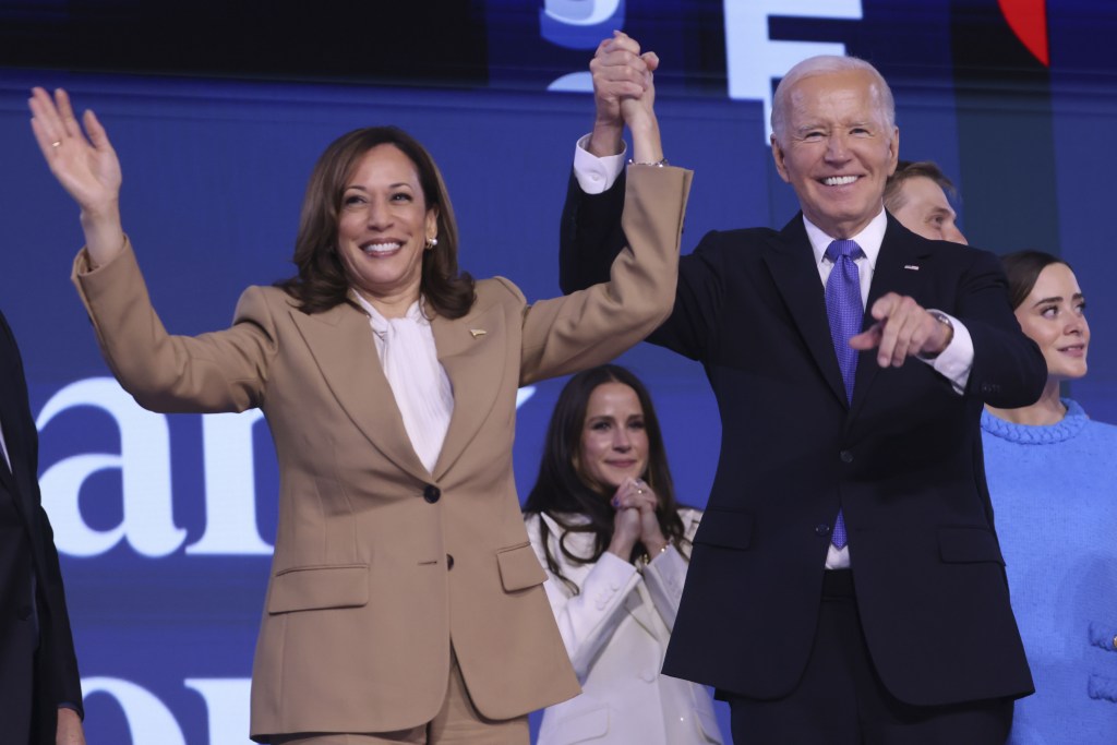 US President Joe Biden and Vice President Kamala Harris waving to the audience at the Democratic National Convention in Chicago, Illinois, USA on August 19, 2024