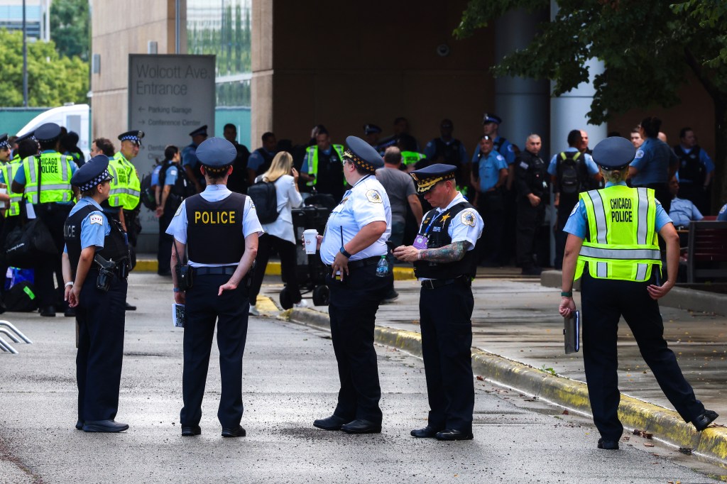 Police officers gather outside the United Center ahead of the Democratic National Convention.