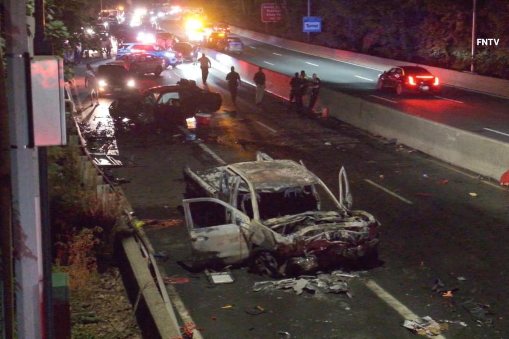 A fiery three-car collision injured multiple occupants, one possibly dead.