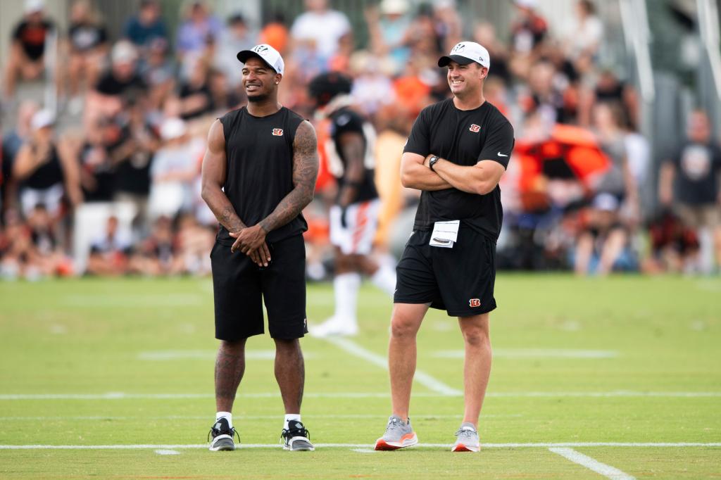 Ja'Marr Chase, left, talks to head coach Zac Taylor, right, on the sidelines during training camp on Wednesday, Aug. 7, 2024, in Cincinnati.