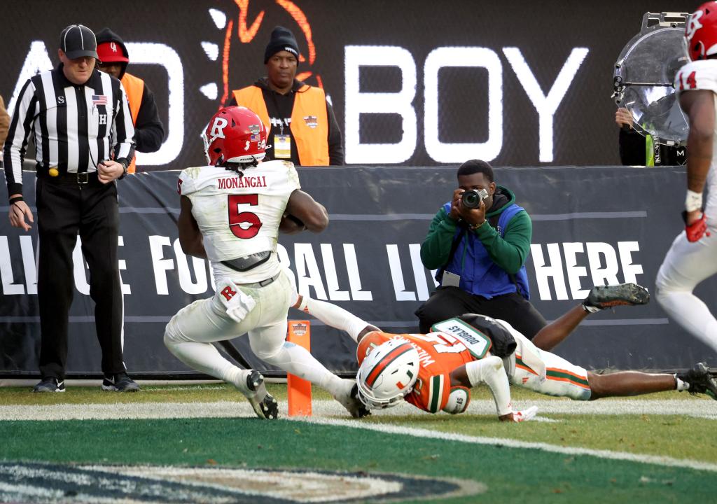 Kyle Monangai fights his way into the end zone during the Pinstripe Bowl against Miami.