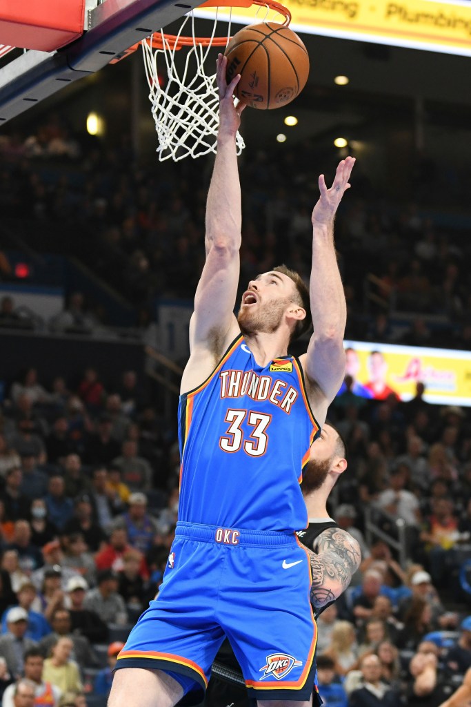 Oklahoma City Thunder forward Gordon Hayward shoots in front of San Antonio Spurs forward Sandro Mamukelashvil during the first half of an NBA basketball game Wednesday, April 10, 2024, in Oklahoma City.