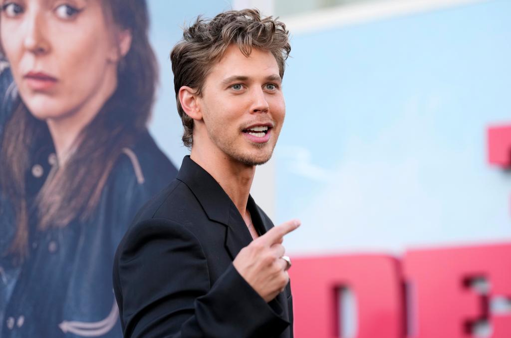 Austin Butler, cast member of 'The Bikeriders,' interacting with photographers at the film premiere in TCL Chinese Theatre, Los Angeles.