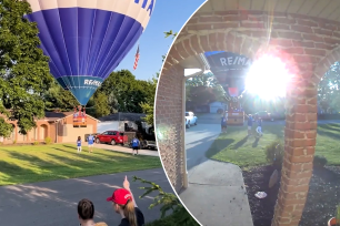 Residents of a Massillon neighborhood captured footage of the RE/MAX balloon passing over a rooftop and coming to rest in the front lawn of a home as onlookers cheered.