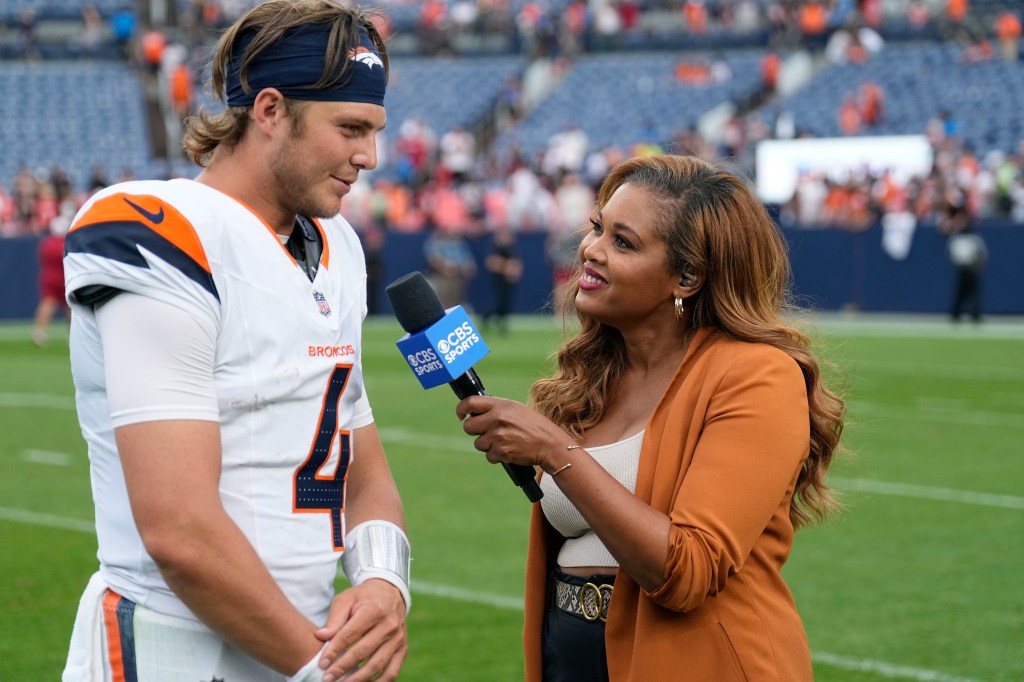 CBS Sports football reporter A.J. Ross interviews Denver Broncos quarterback Zach Wilson after a preseason NFL football game against the Arizona Cardinals Sunday, Aug. 25, 2024.