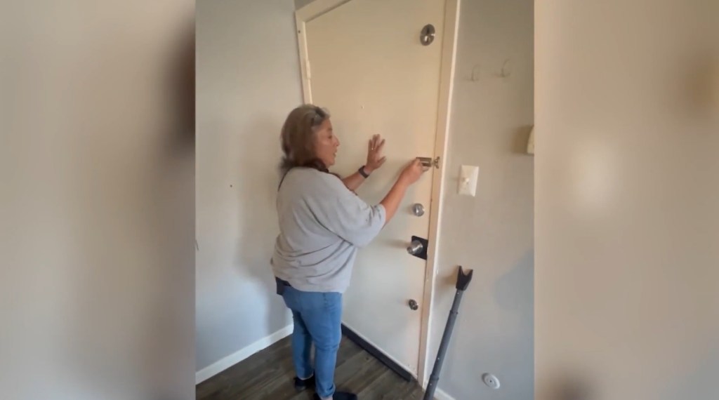 Cindy Romero locks her door inside the apartment building overrun by a Venezuelan gang.