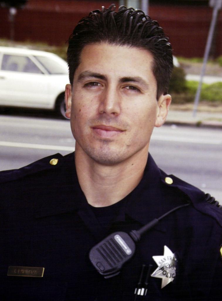 Photo of Isaac Espinoza in cop uniform 