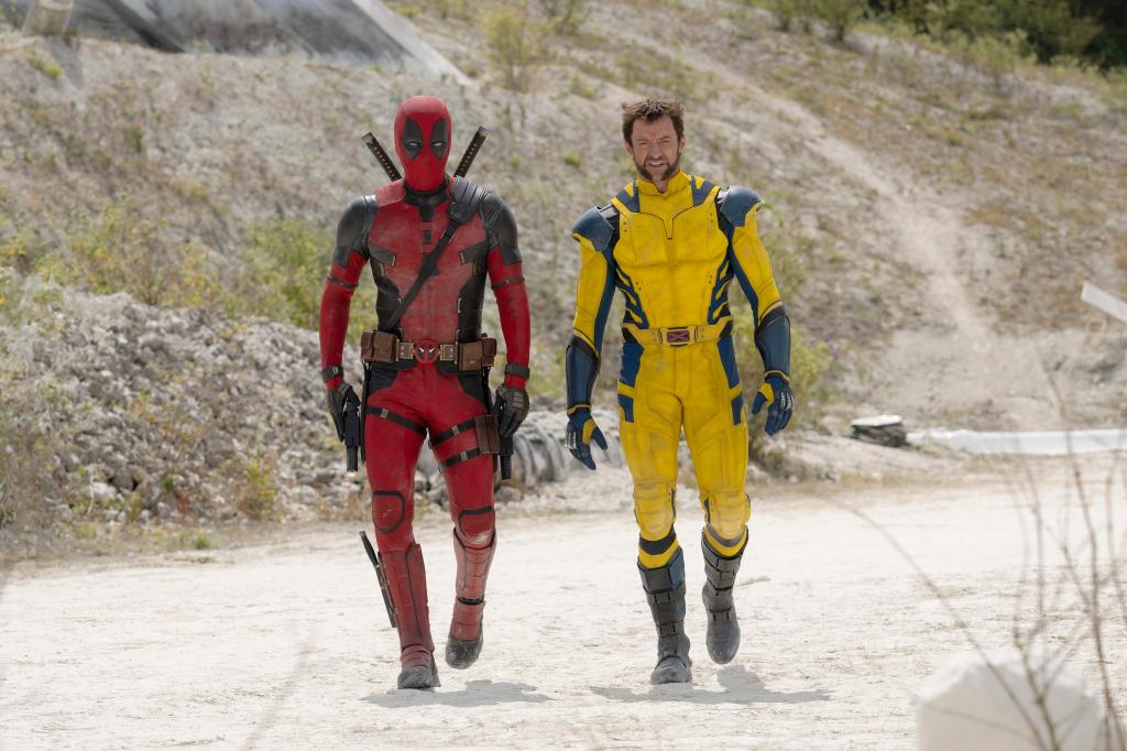 Ryan Reynolds, left, as Deadpool/Wade Wilson and Hugh Jackman, right, as Wolverine/Logan walk in a scene from "Deadpool & Wolverine." 