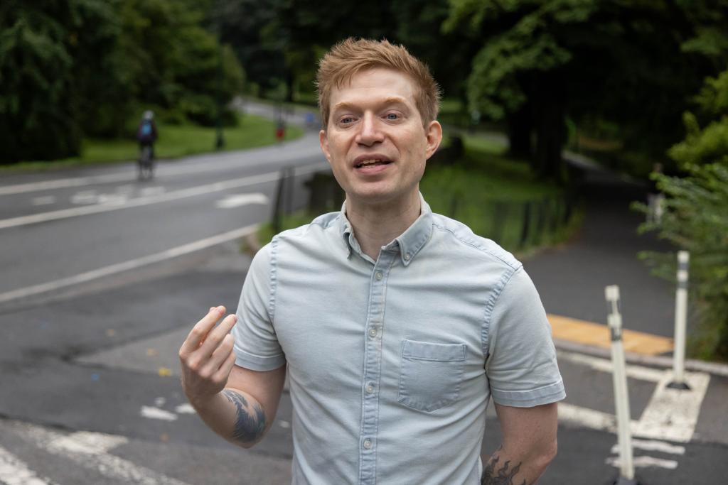 Julian De Flandres, victim of a robbery, speaks during an interview in Central Park on August 7, 2024