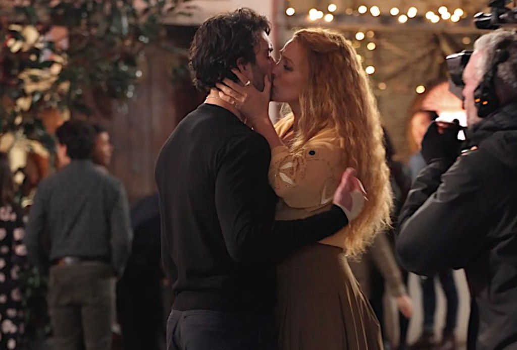 Justin Baldoni, left, and Blake Lively kiss on the set of 'It Ends with Us' on January 12, 2024.