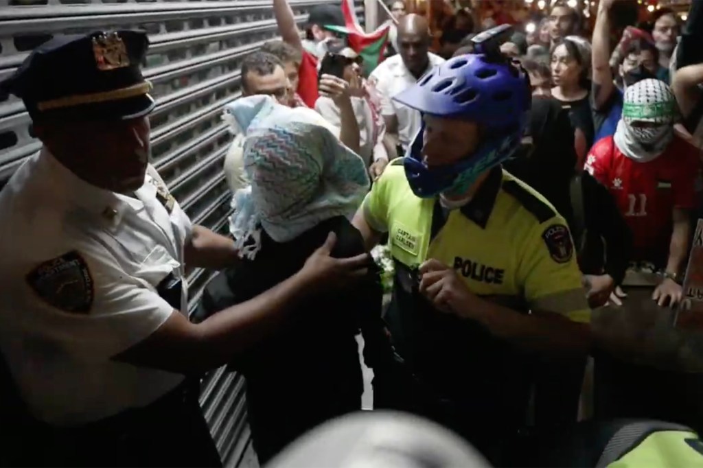 Police clashing with anti-Israel protesters in Harlem on Aug. 14, 2024.