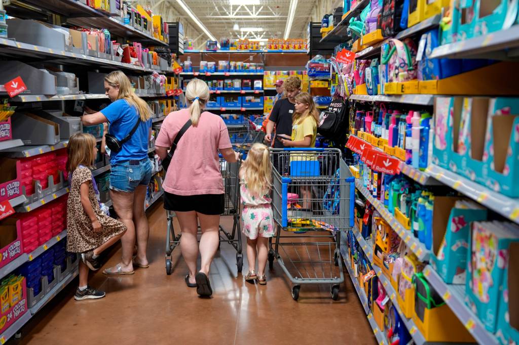 People shopping for school supplies at a Walmart store in Edmond, Oklahoma on July 30, 2024.