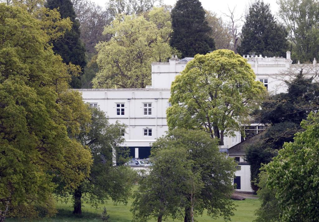 Prince Andrew's white royal lodge located on the grounds of Windsor Castle, surrounded by trees