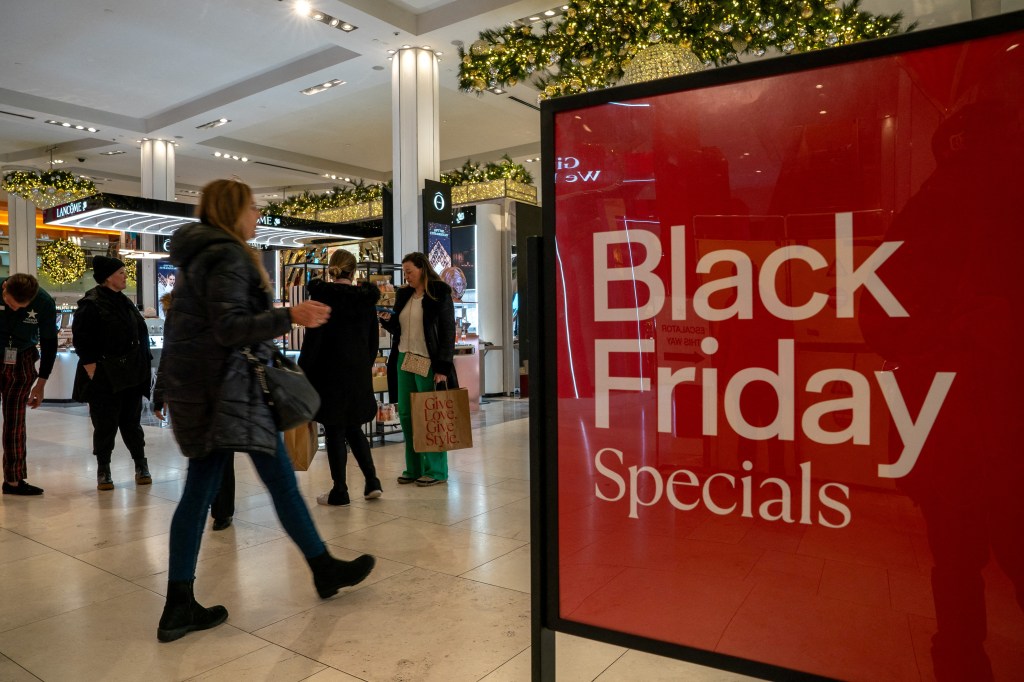 Shoppers walking at Macy's department store during Black Friday shopping in Manhattan, New York City, November 24, 2023.