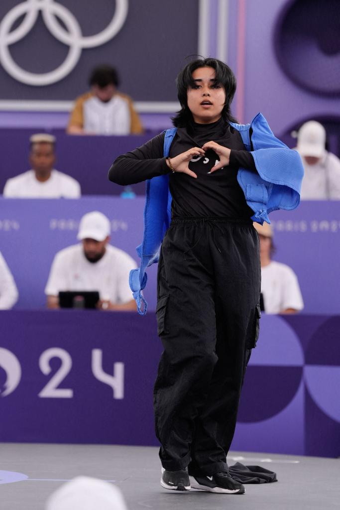 Talash of Team of Refugee Olympic Team competes while wearing a outfit which reads "Free Afghan women" during the B-girls Pre-Qualifier on day fourteen of the Olympic Games Paris 2024 at Place de la Concorde on August 9, 2024 in Paris, France.