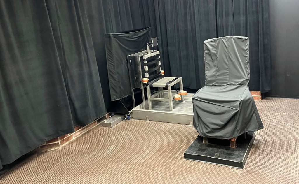 South Carolina's "death chamber" with electric chair covered and black curtains hanging around the room