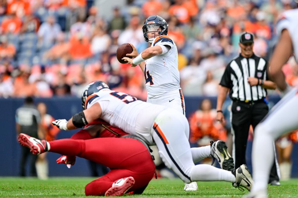 Zach Wilson #4 of the Denver Broncos throws a pass for a fourth quarter touchdown against the Arizona Cardinals during the preseason game at Empower Field at Mile High on August 25, 2024 in Denver, Colorado.  