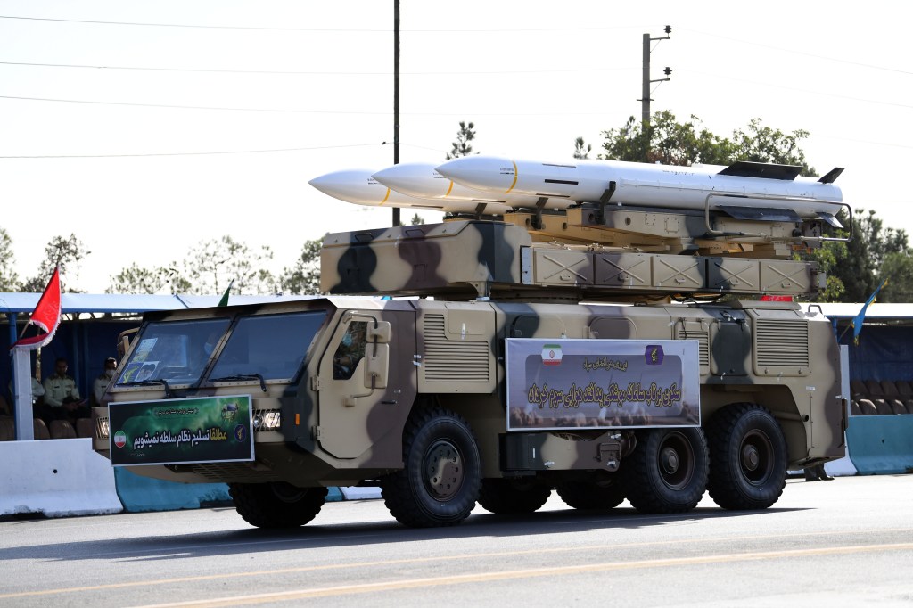 Military parade in Tehran, Iran showcasing newly unveiled long-range ballistic missile on a military vehicle, September 21, 2024