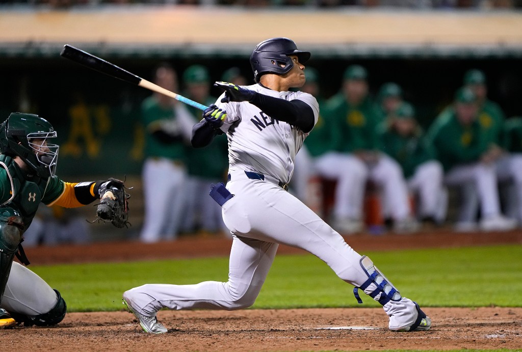 Juan Soto #22 of the New York Yankees hits a pinch-hit RBI double scoring Oswaldo Cabrera #95 (not in the image) against the Oakland Athletics in the top of the 10th inning at the Oakland Coliseum on September 20, 2024 in Oakland, California. 