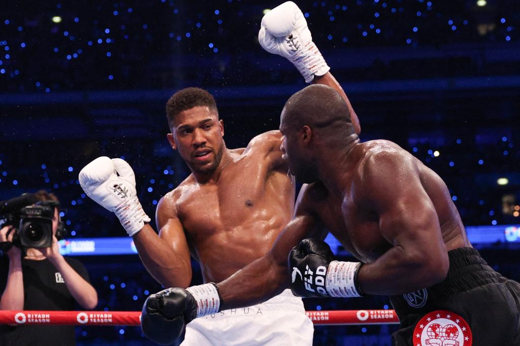 Daniel Dubois presses the attack during his fifth-round knockout win over Anthony Joshua.