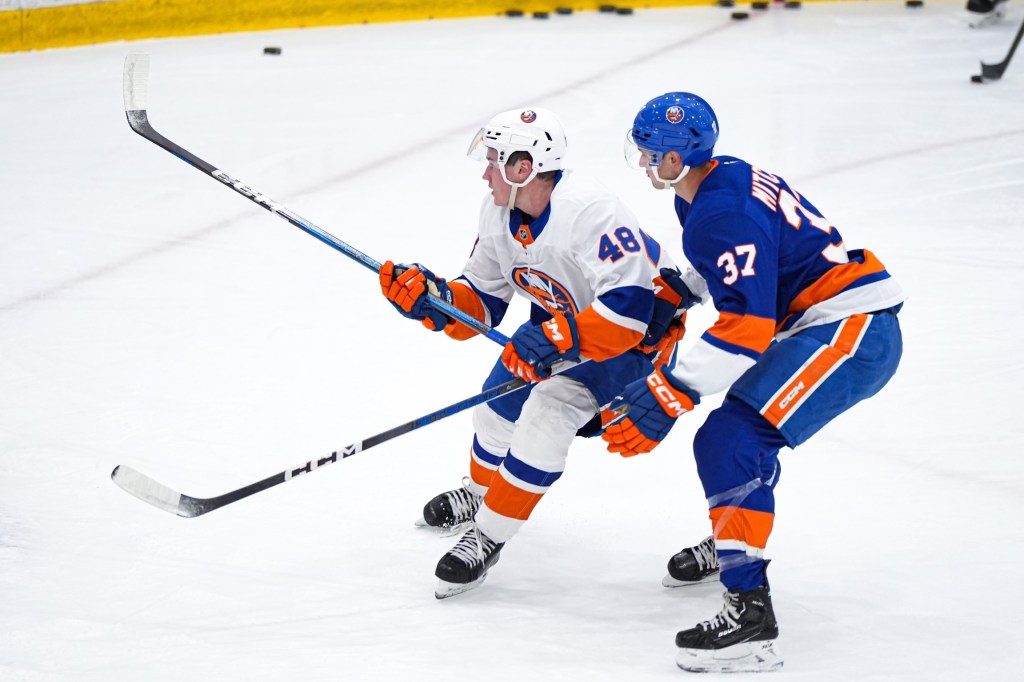 Islanders prospect Matt Maggio (left) battles Travis Mitchell for the puck during a recent practice. 