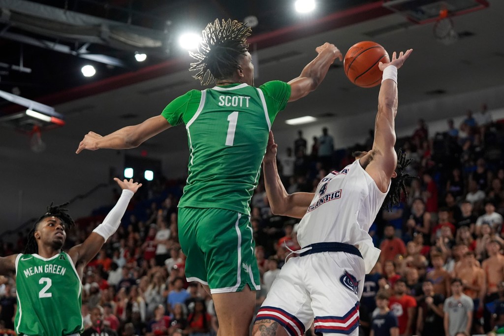 Aaron Scott blocks a shot during a North Texas game last season.