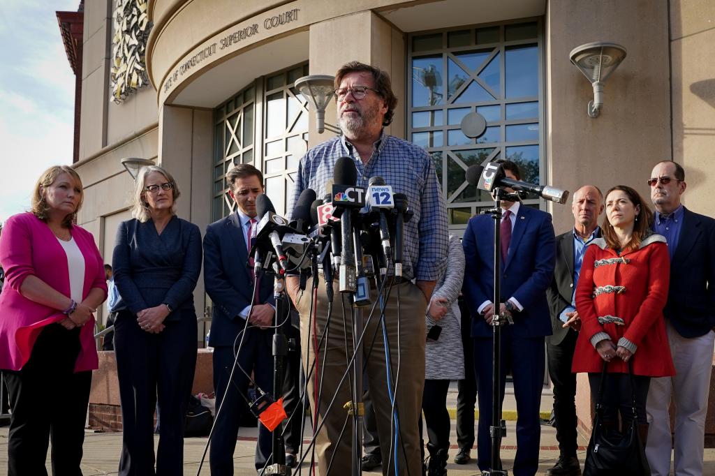 Bill Sherlach, husband of Mary, one of the Sandy Hook School shooting victims, speaks to the media after jurors returned a $965 million dollar judgement in the defamation trial against Alex Jones in October 2022.