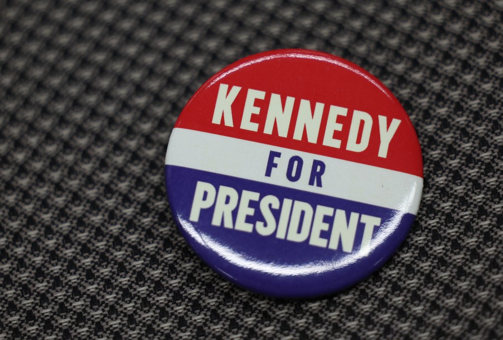 Robert F. Kennedy, Jr. speaking at the Libertarian National Convention with a visible campaign button, on May 24, 2024.