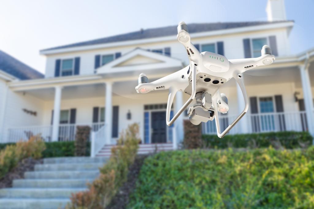 Drone Quadcopter Flying, Inspecting and Photographing House.