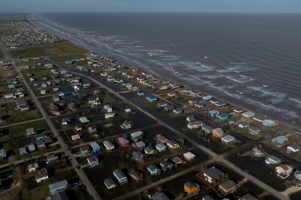  A drone view shows flood waters surrounding homes in the aftermath of Hurricane Beryl in Surfside Beach, Texas, U.S., July 8, 2024.