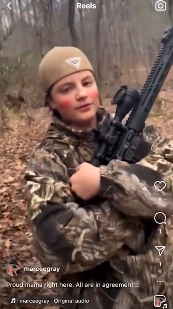 Colt Gray holding a firearm wearing hunting gear.