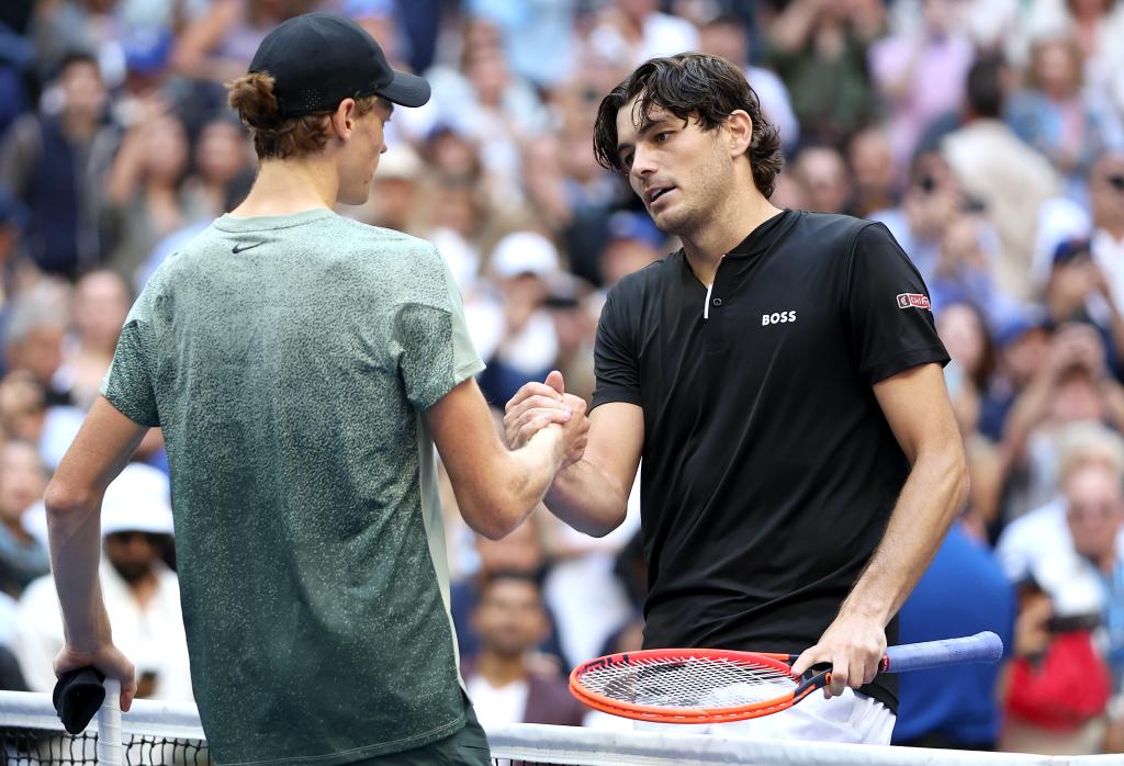 Jannik Sinner (R) of Italy shakes hands with Taylor Fritz of the United States after defeating him to win the Men's Singles Final on Sept. 8, 2024.