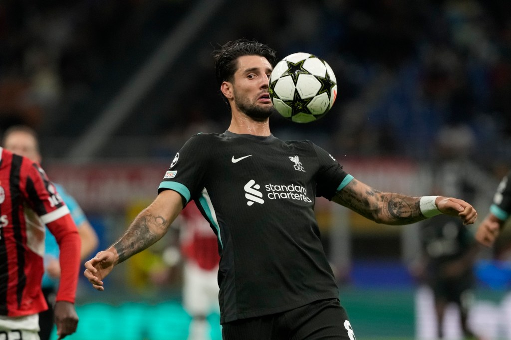 Liverpool's Dominik Szoboszlai controls the ball during the Champions League opening phase soccer match between AC Milan and Liverpool at the San Siro stadium in Milan, Italy, on Sept. 17, 2024.