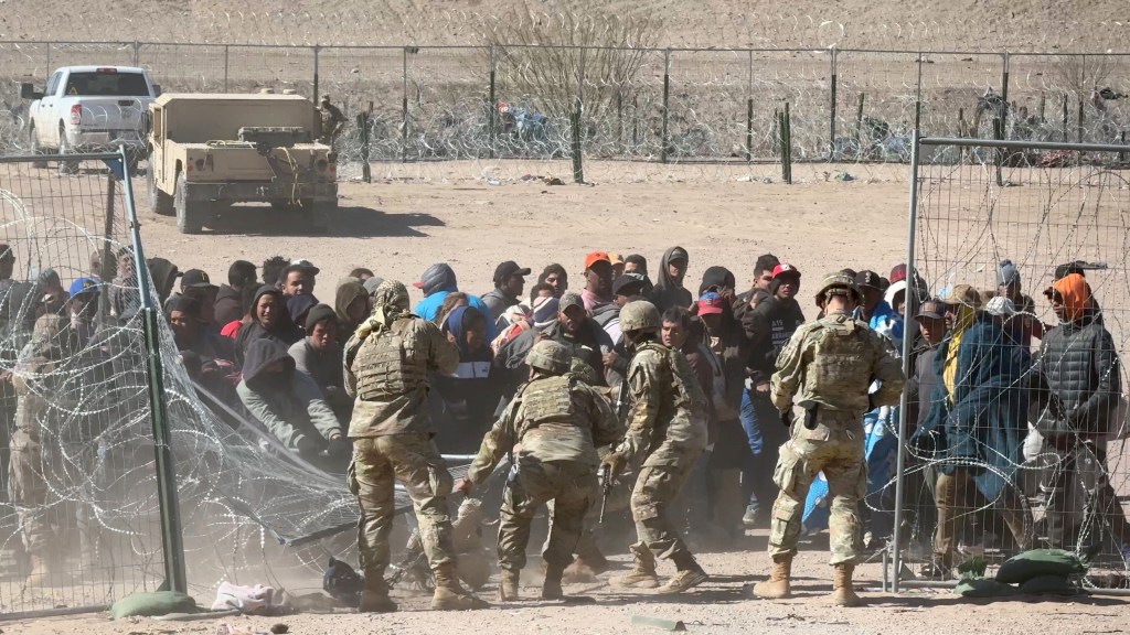 Soldiers at the border in El Paso, Texas, attempt to control dozens of migrant rioters who tried to make their way in during a wild caught-on-camera scene captured by The Post in March.