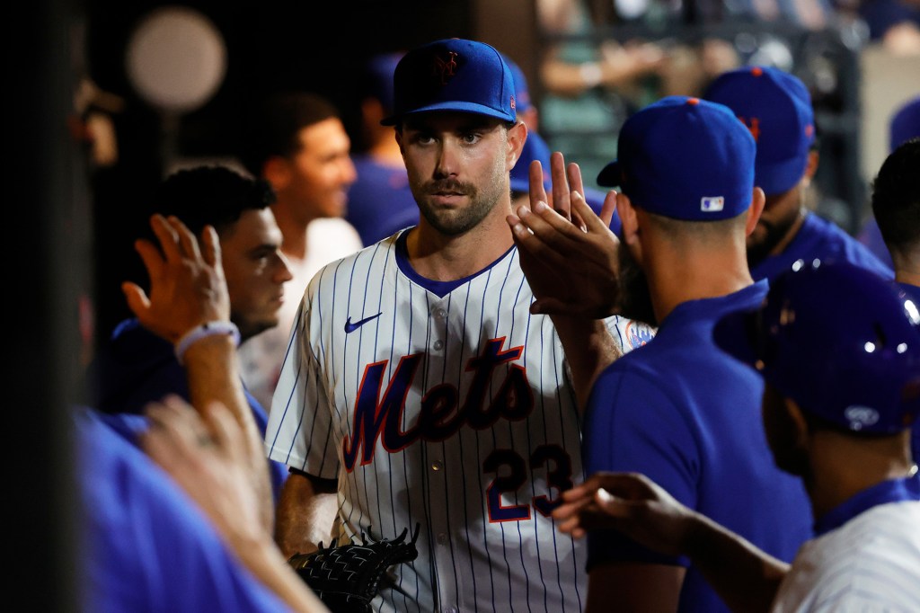 David Peterson walks through the Mets' dugout following a start during the 2024 season.