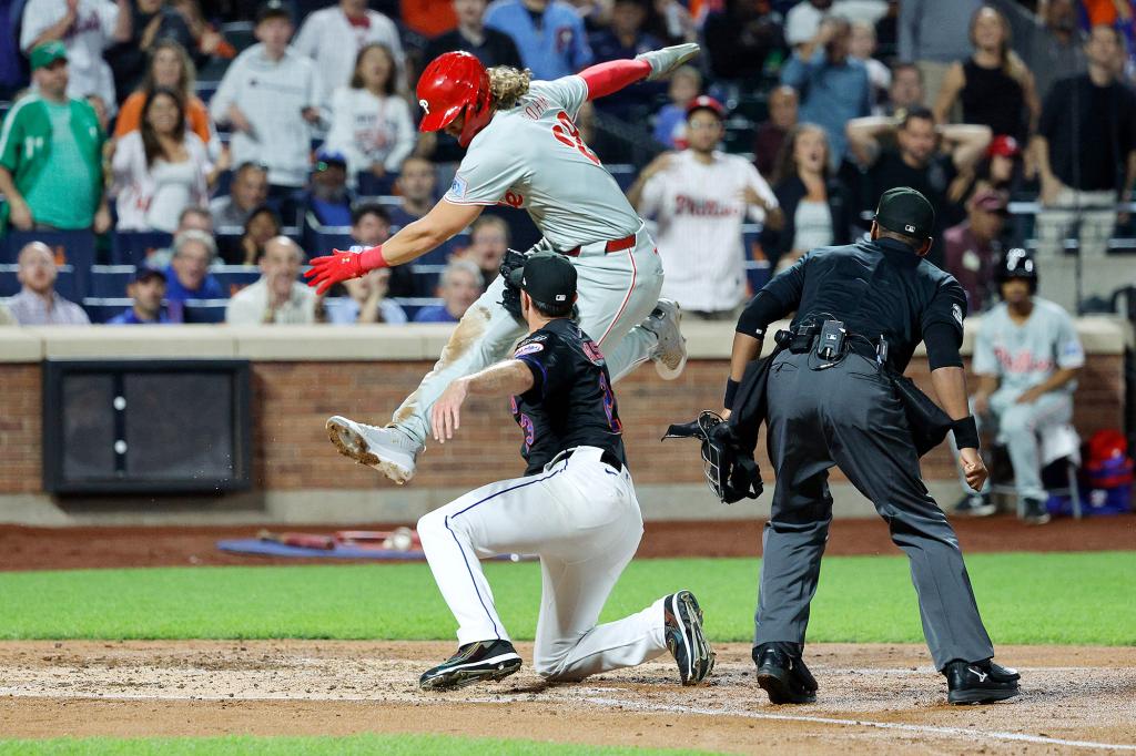 David Peterson tags out the Phillies Alec Bohm during his start for the Mets on Sept. 20.