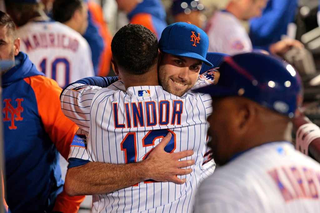 David Peterson embraces Francisco Lindor during the 2023 season.