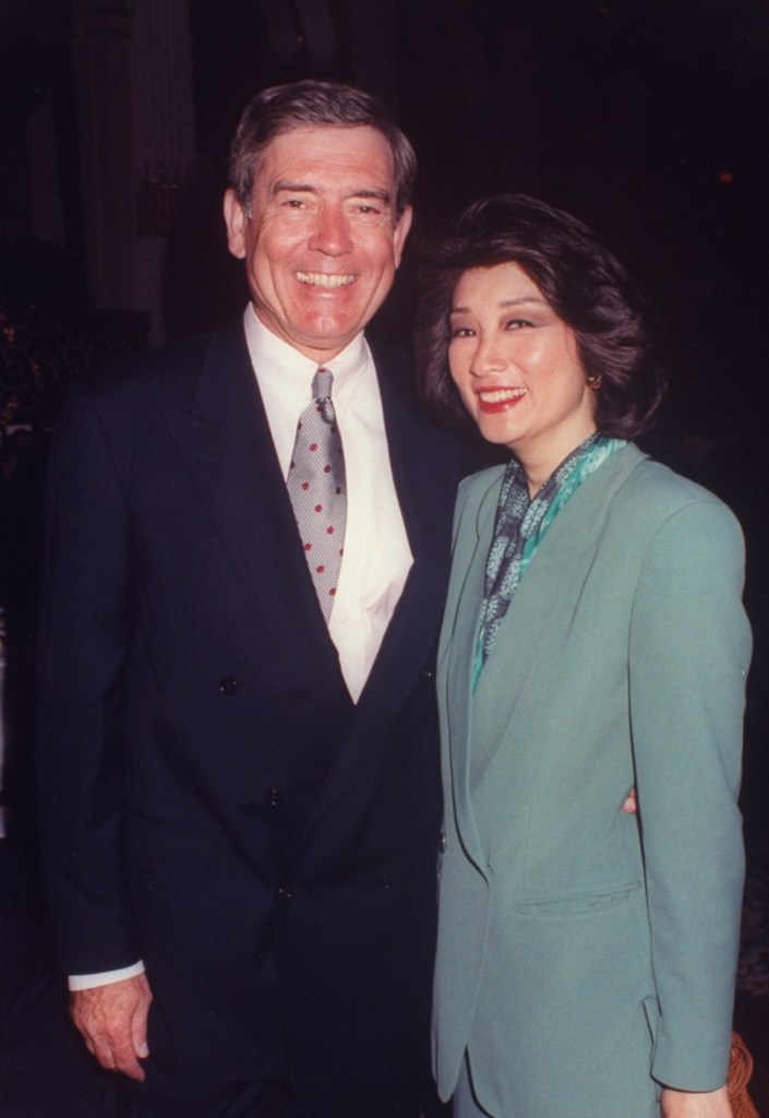 CBS News co-anchors Dan Rather and Connie Chung smiling at the camera.