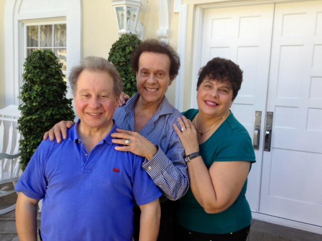 Richard Simmons (center) pictured with his brother Lenny Simmons (left) and Lenny's wife Cathy in a photo posted to X on Dec 26, 2013.