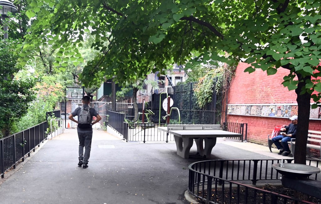 The table is just inches from the park's playground.