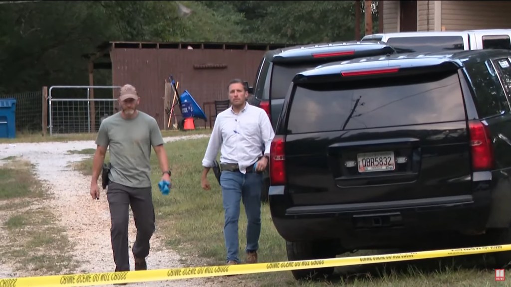 Police and investigators outside the home of Colt Gray near a black SUV, following his arrest for a shooting at Apalachee High School