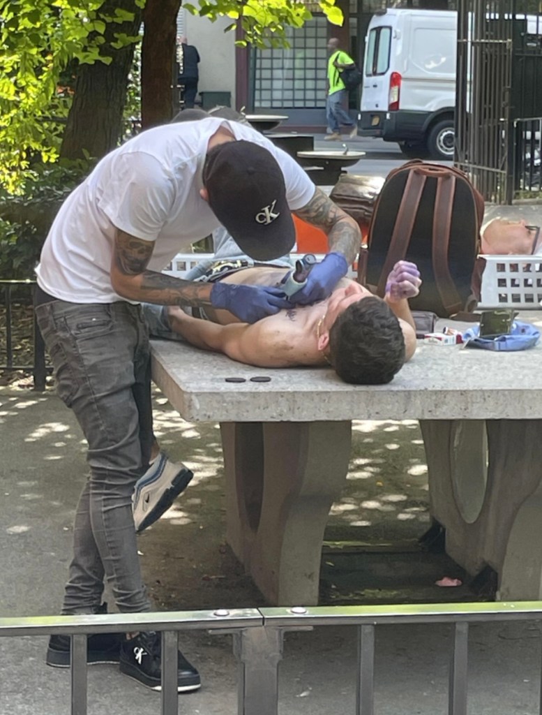 A photo of the open air tattooing happened on Monday afternoon.