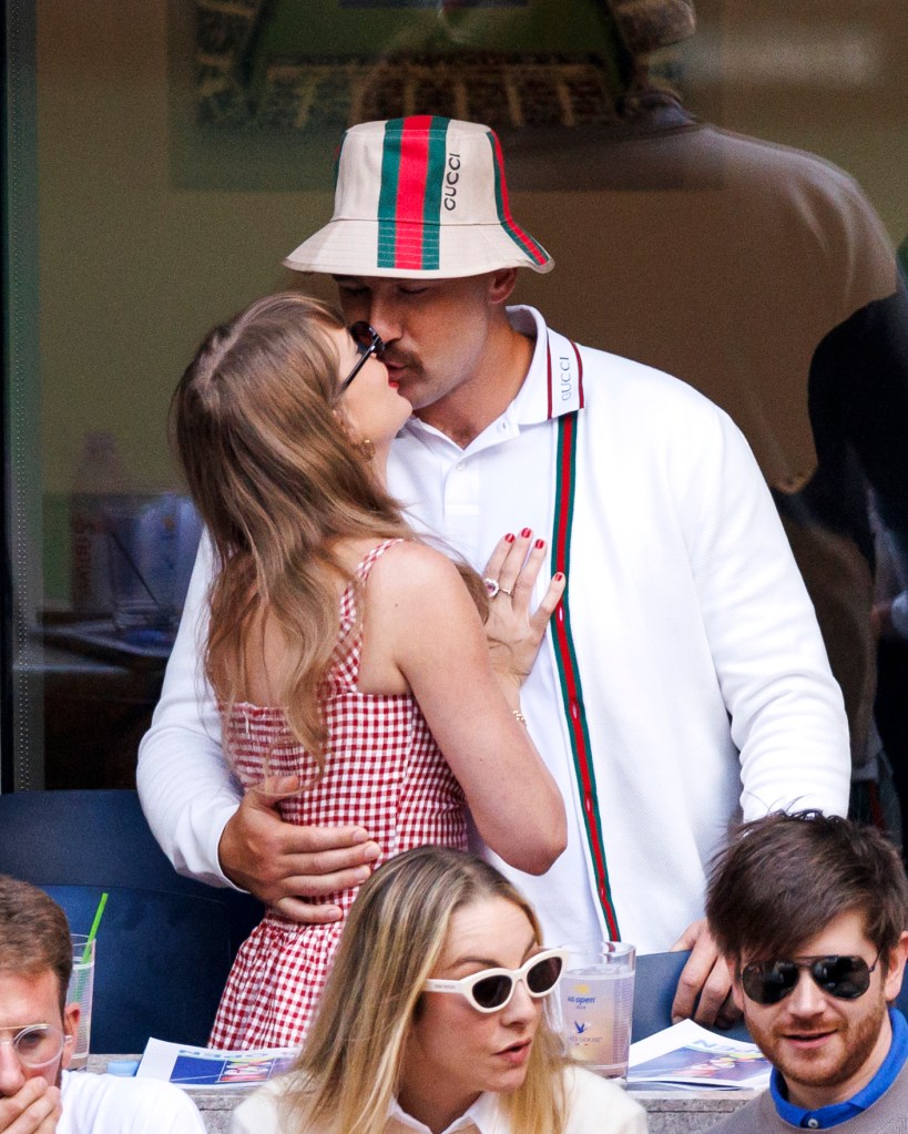 Taylor Swift and Travis Kelce kiss during the U.S. Open men's final on Sept. 8, 2024.