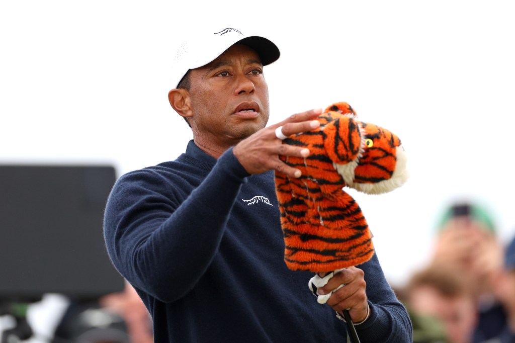 Tiger Woods removing a club head cover on the fourth tee during day two of The 152nd Open championship at Royal Troon, Scotland