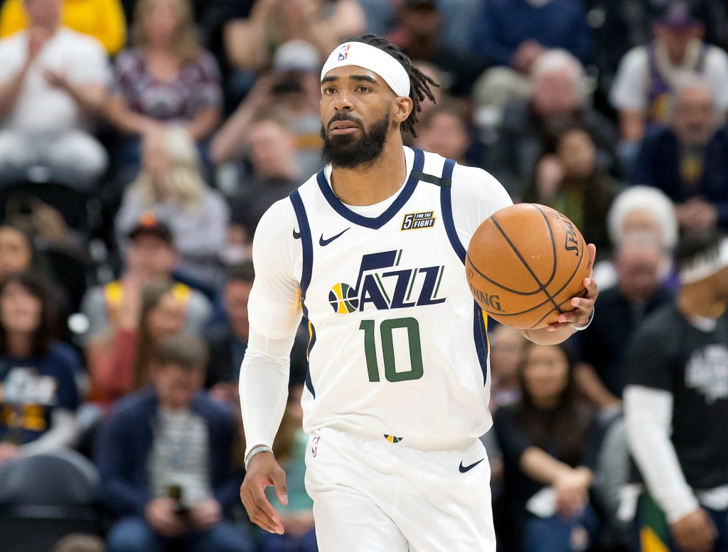 Mike Conley (10) dribbles up the court against the Washington Wizards during the first quarter at Vivint Smart Home Arena during a game in 2020.