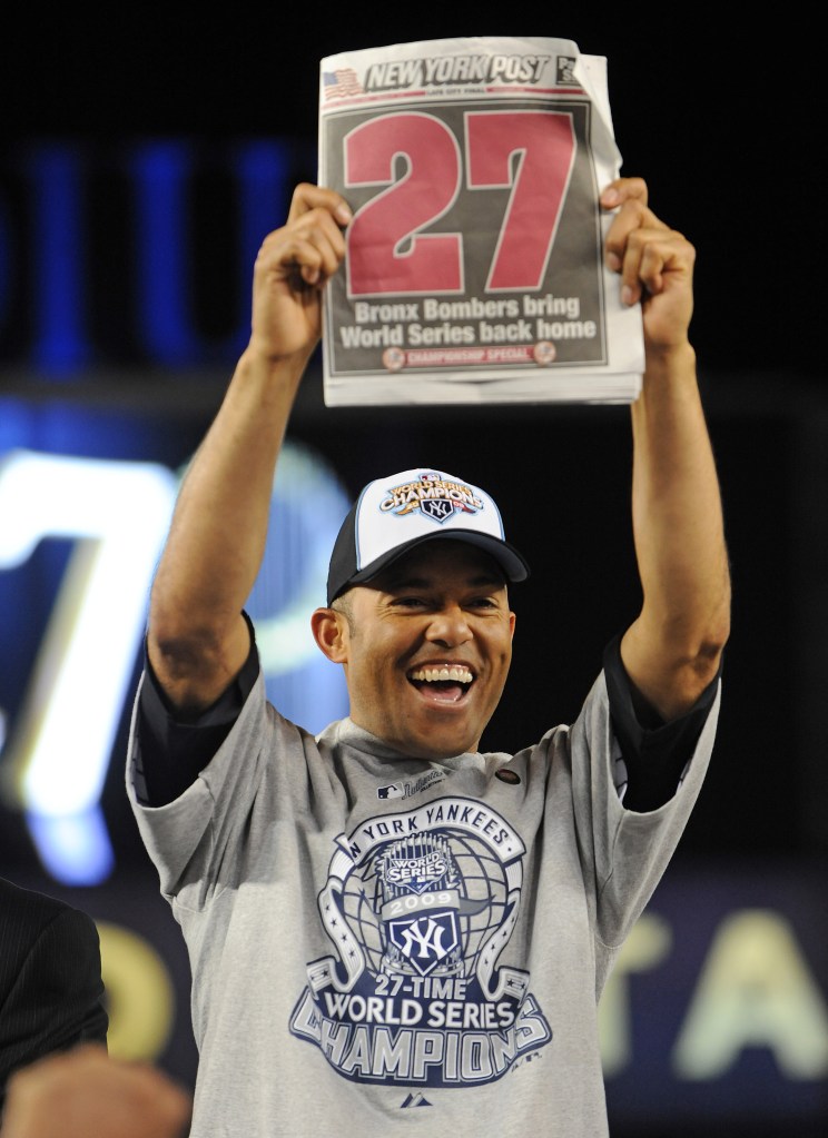 Mariano Rivera holds up The Post after winning the 2009 World Series.